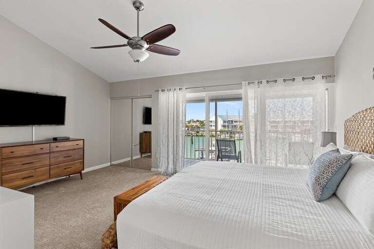 3rd level master suite with a king bed and an ensuite bath.