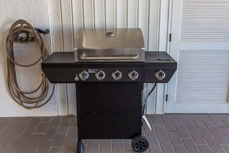 Brand new Nexgrill 4-burner propane gas grill with side burner.