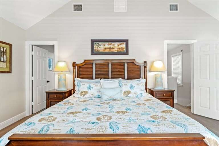 2nd level mater suite with a king bed.