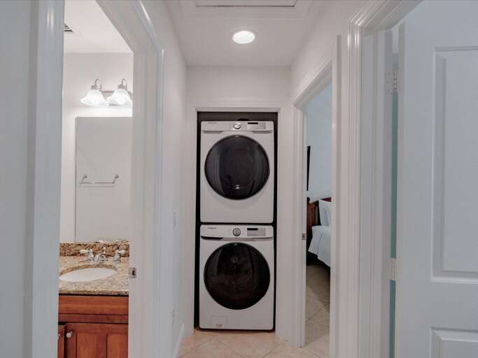 Upstairs bath laundry area. Upstairs bath laundry area.