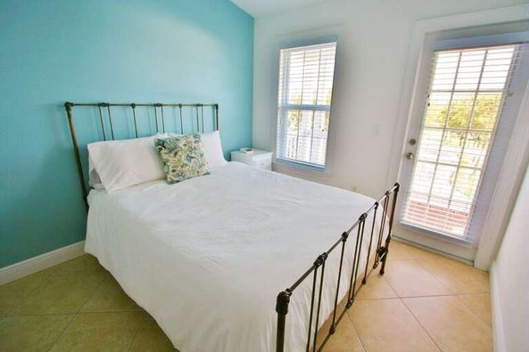 2nd level 2nd bed room with a queen bed.