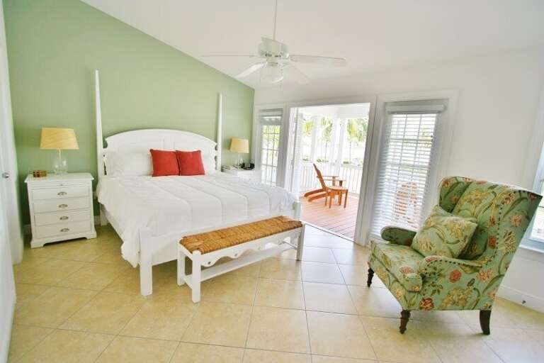 2nd level master suite with a king bed, ensuite full bathroom and an access to a balcony.