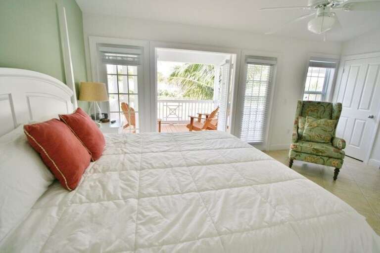 2nd level master suite with a king bed, ensuite full bathroom and an access to a balcony.