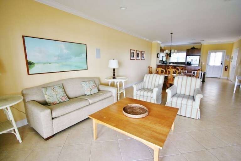 Experience an open-concept layout seamlessly connecting the kitchen, living room, and dining area, flooded with ample natural light.