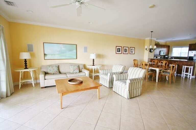 Experience an open-concept layout seamlessly connecting the kitchen, living room, and dining area, flooded with ample natural light.