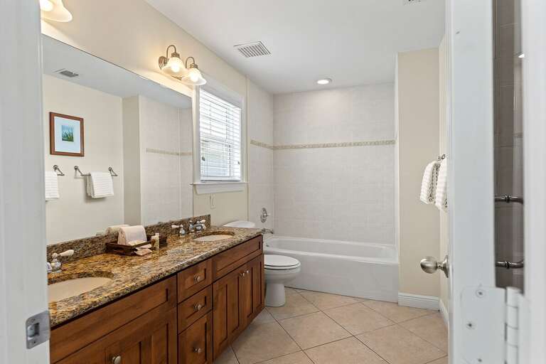 Your en-suite full bathroom for the master suite. Complete with a bath tub, double sink and large mirrors.