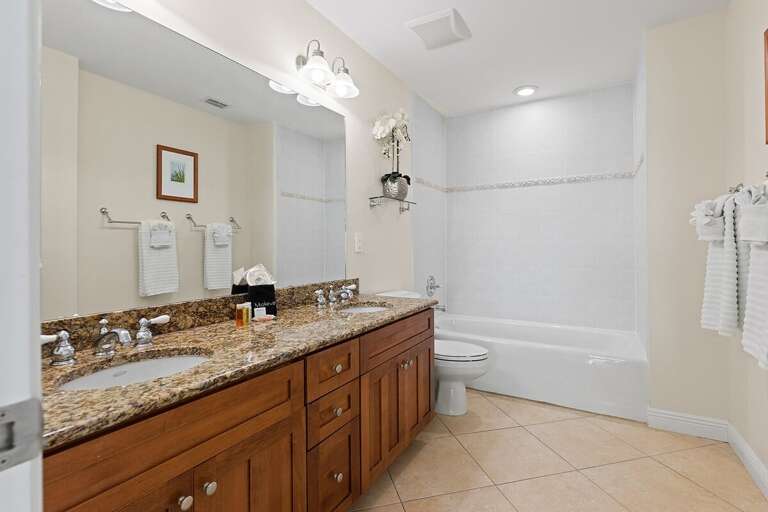 Your en-suite full bathroom for the master suite. Complete with a bath tub, double sink and large mirrors. Your en-suite full bathroom for the master suite. Complete with a bath tub, double sink and large mirrors.