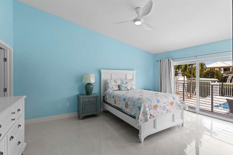 Master bedroom on the first level with ensuite full bathroom and walk-in closet.