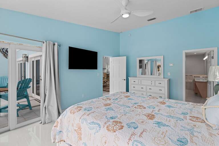 Master bedroom on the first level with ensuite full bathroom and walk-in closet.