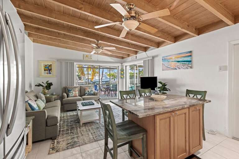 Spacious open-concept living area seamlessly blending the kitchen, dining, and living spacesperfect for entertaining and relaxation.