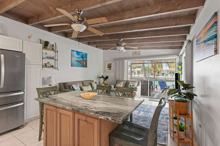 Spacious open-concept living area seamlessly blending the kitchen, dining, and living spacesperfect for entertaining and relaxation.