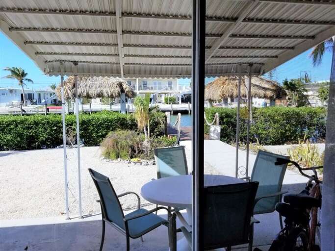 Beautiful view of the yard and canal from inside the home. Beautiful view of the yard and canal from inside the home.
