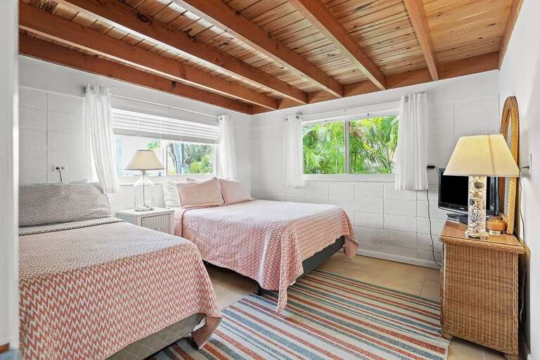 Second bedroom with two beds and private bath. Second bedroom with two beds and private bath.