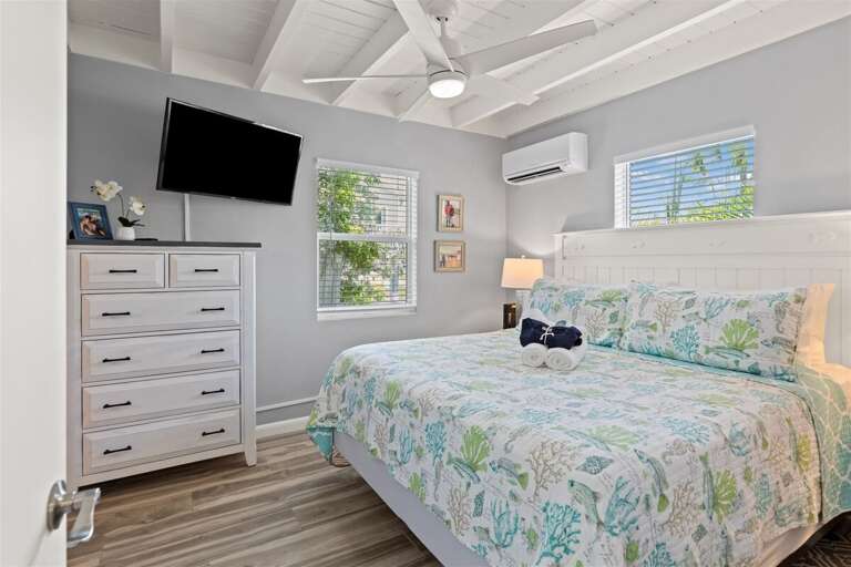 The master suite with a king bed, and a smart TV.