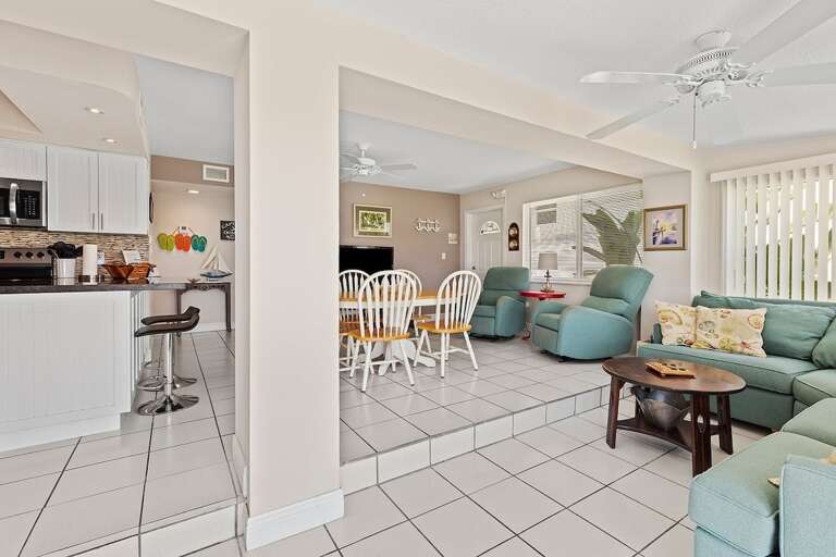 Plenty of seating to lounge in the living room, or enjoy meals with friends and family in the dining area.