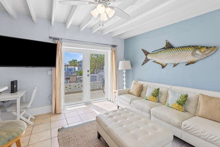 Cozy living room flooded with natural light, perfect for lounging and TV time.