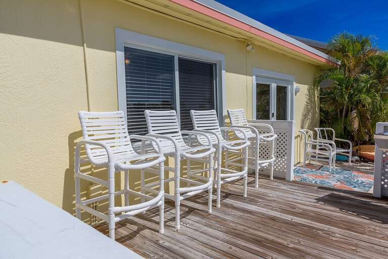 Inviting backyard seating area, perfect for relaxation and outdoor gatherings.