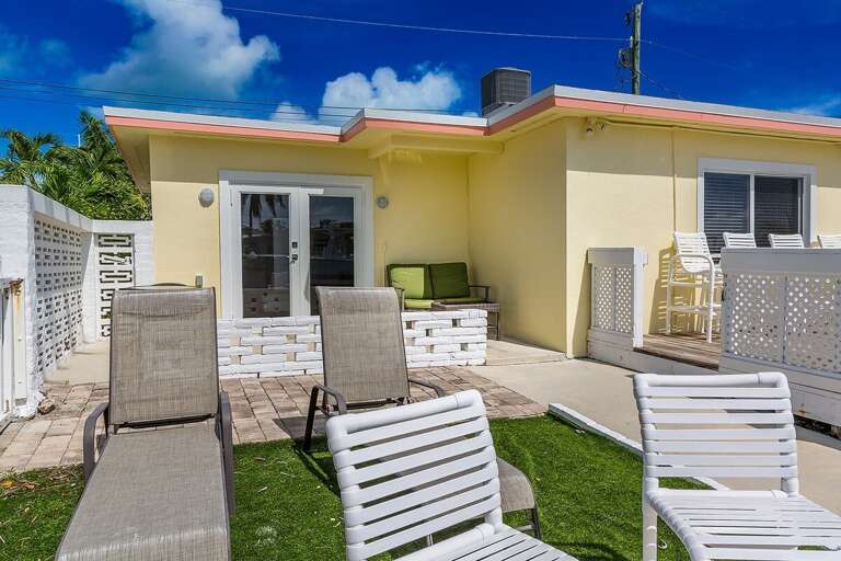Inviting backyard seating area, perfect for relaxation and outdoor gatherings.