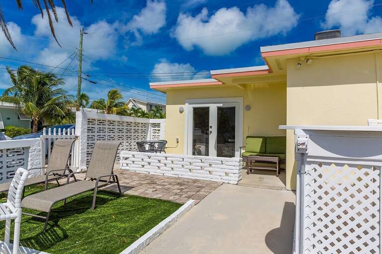 Inviting backyard seating area, perfect for relaxation and outdoor gatherings.