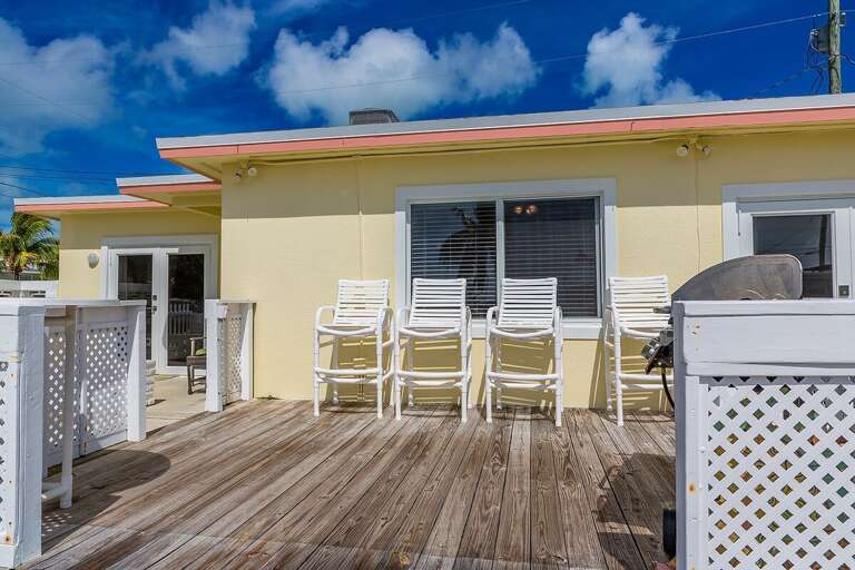 Inviting backyard seating area, perfect for relaxation and outdoor gatherings.