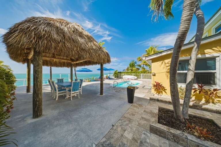 Heated pool with panoramic ocean views and stunning sunset skies in Marathon, Florida Keys.