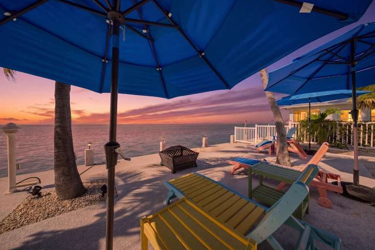 Private backyard with dock and open ocean views at this premium Florida Keys vacation home in Marathon, FL.