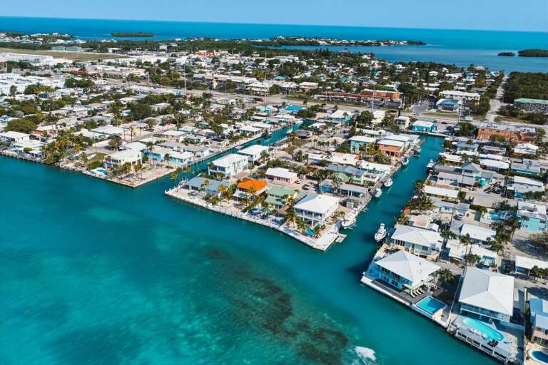 Stunning aerial showcasing unobstructed coastal water views from this Florida Keys property.