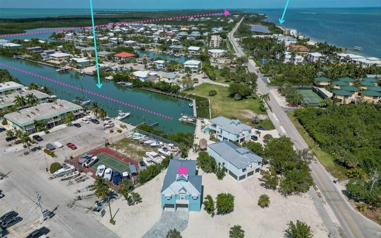 Aerial view showing route to the ocean from the canal, and location of Coco Plum Beach.