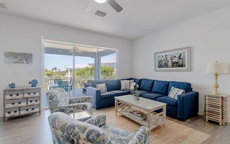 Charming living room decor with comfy seating arrangement and smart TV.