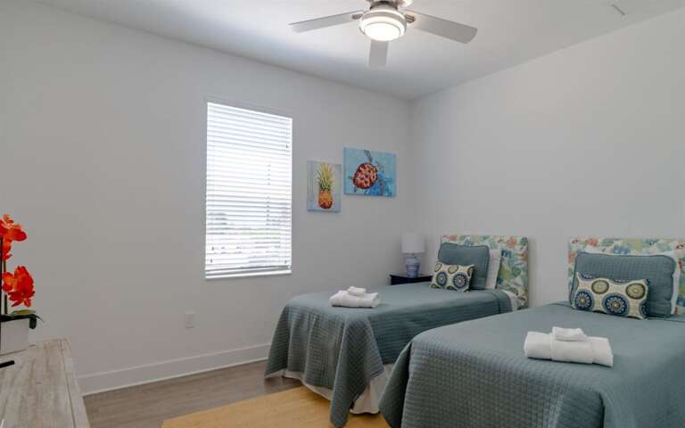 First double twin bedroom with smart TV on the 2nd level.