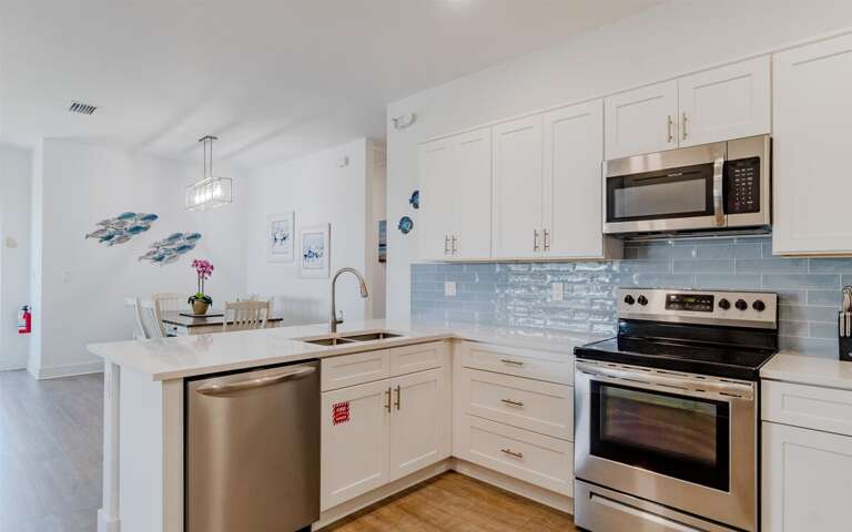 Fully stocked kitchen with Keurig coffee maker.