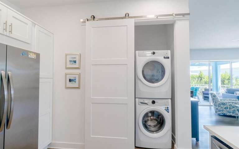 In-house washer dryer near kitchen.