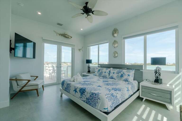 3rd level king bedroom master suite with shared balcony overlooking the pool and open water.