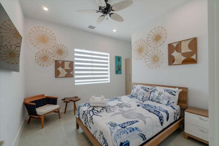 3rd level queen bedroom with ensuite bathroom and smart TV.