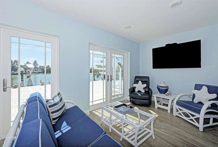 1st level living room with water views and pool access