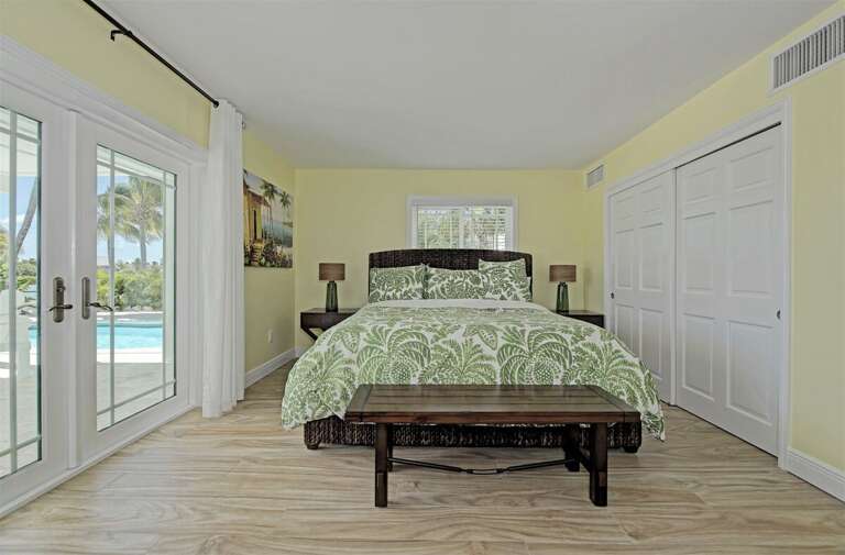 1st level master with king bed and pool/patio access