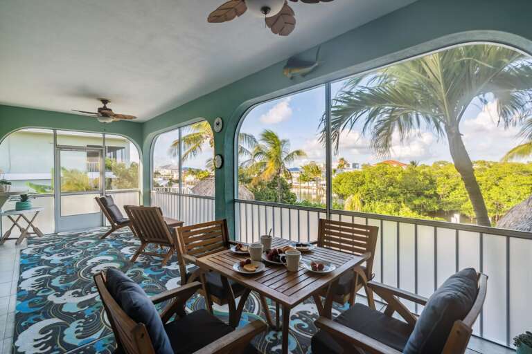Covered back deck with outdoor seating and ocean views in the Florida Keys.