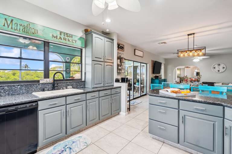 Modern kitchen with stainless steel appliances and granite countertops in Florida Keys rental. Modern kitchen with stainless steel appliances and granite countertops in Florida Keys rental.