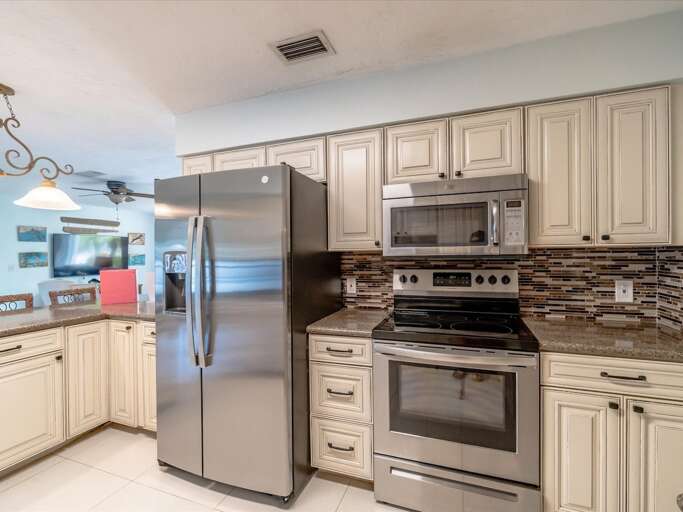 Fully stocked kitchen with plenty of counterspace Fully stocked kitchen with plenty of counterspace