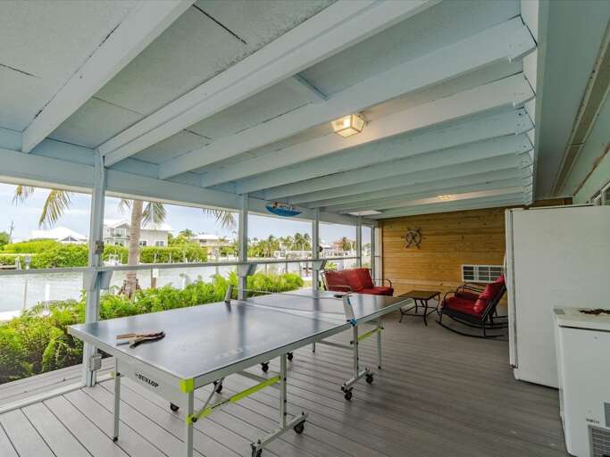 Relax on the back porch, or compete with family and friends in ping pong or bimini ring Relax on the back porch, or compete with family and friends in ping pong or bimini ring