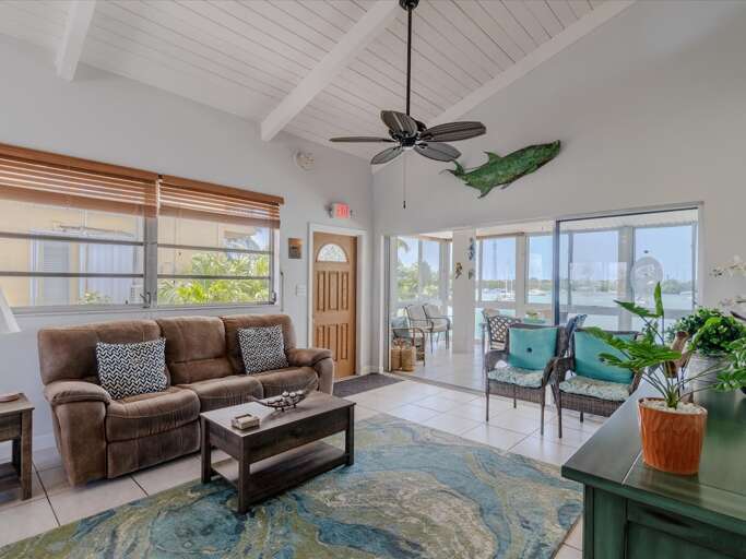 Living room with a large TV and comfortable sofa. Living room with a large TV and comfortable sofa.