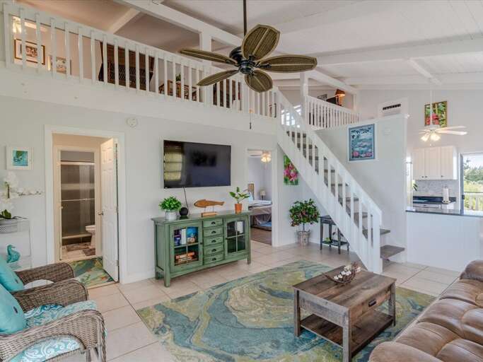 Living room with a large TV and comfortable sofa. Living room with a large TV and comfortable sofa.