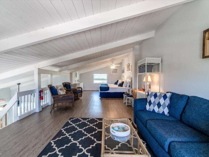 A sofa with pull-out couch on the loft. A sofa with pull-out couch on the loft.