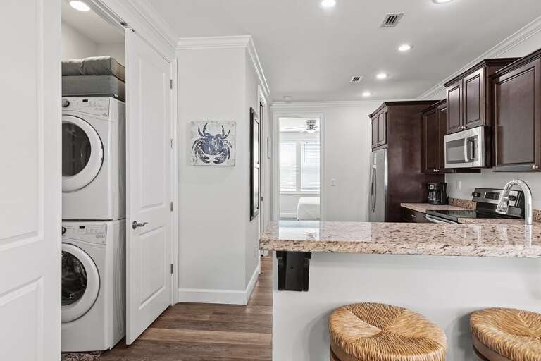 The full kitchen and the laundry area the left.