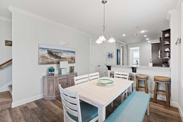 Open-concept dining area and full kitchen.