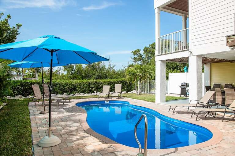 Dive into relaxation at our heated pool oasis. With cozy lounge chairs and shady spots, every moment here is a soothing escape.