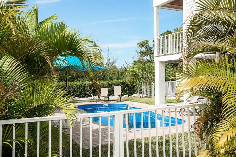 Dive into relaxation at our heated pool oasis. With cozy lounge chairs and shady spots, every moment here is a soothing escape.