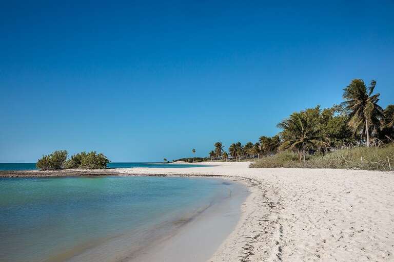 Under the warm embrace of the Florida sun, Sombrero Beach casts its spell of serenity and bliss, inviting you to bask in its sandy shores and azure waters.