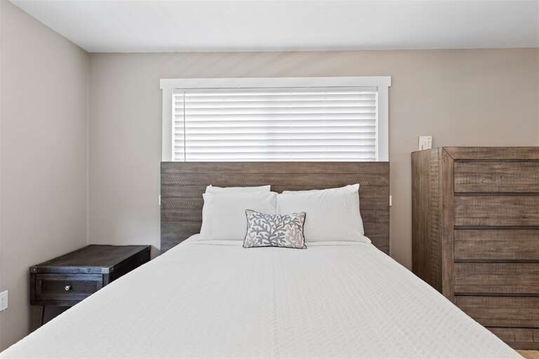 The master suite with a queen bed and ensuite bathroom. The master suite with a queen bed and ensuite bathroom.