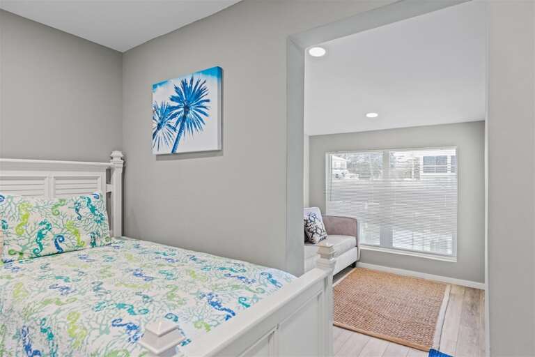 Bedroom 2 with 2 twin beds with sleeper sofa.